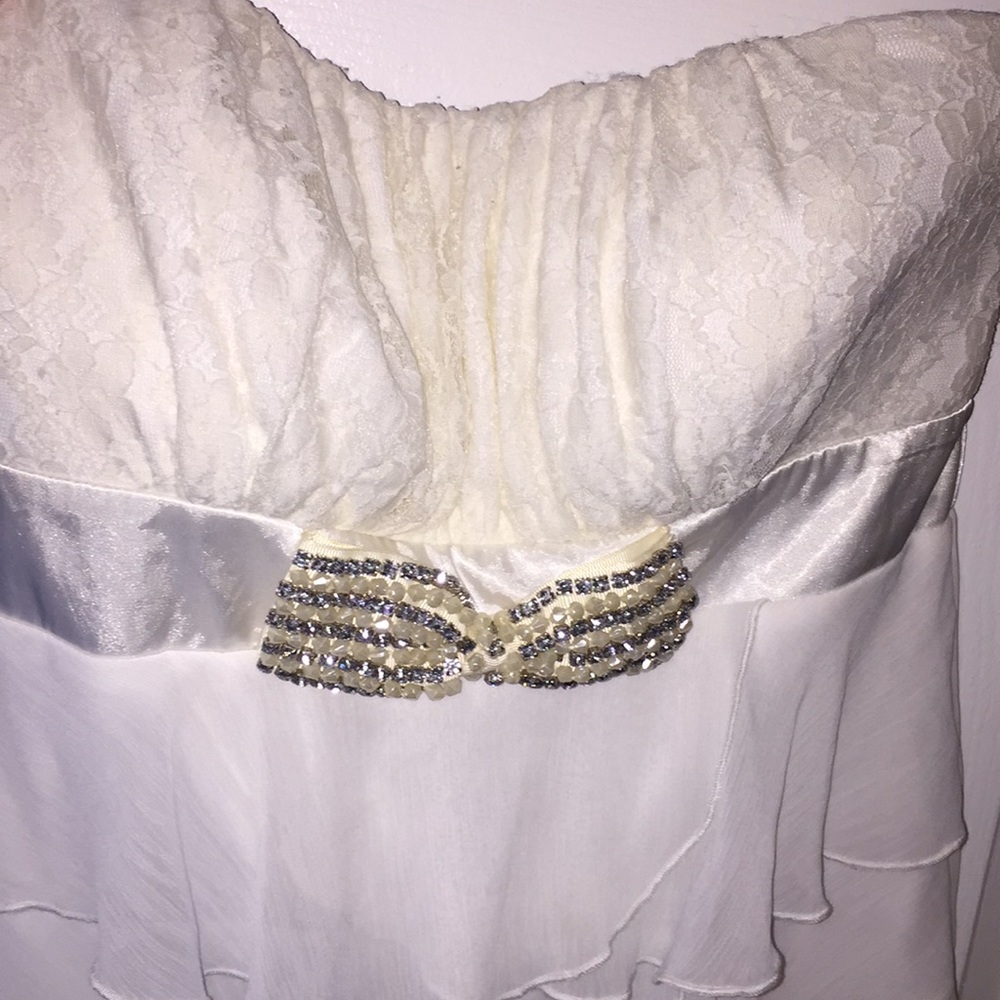 Cream and white strapless blouse